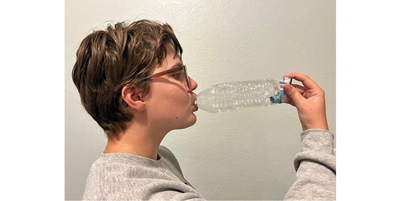 Figure 2. Use of an improvised spacer with a metered dose inhaler