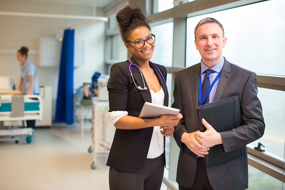 man and woman in patients room RQI request more information image