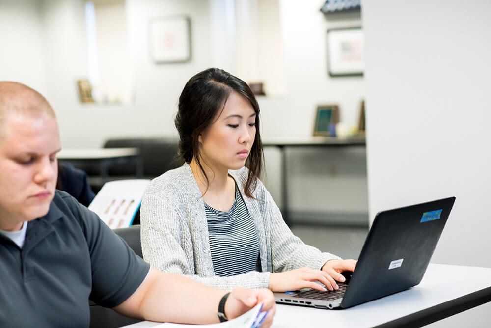 adult trainees studying in classroom