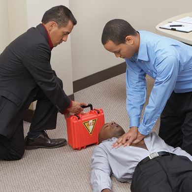man performing CPR in workplace man performing CPR in workplace